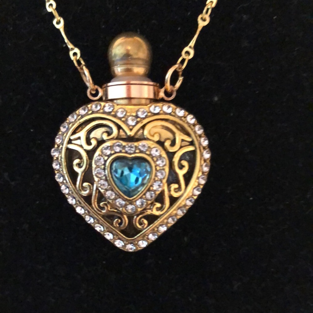 Gold Heart Pendant Necklace with Blue Gem